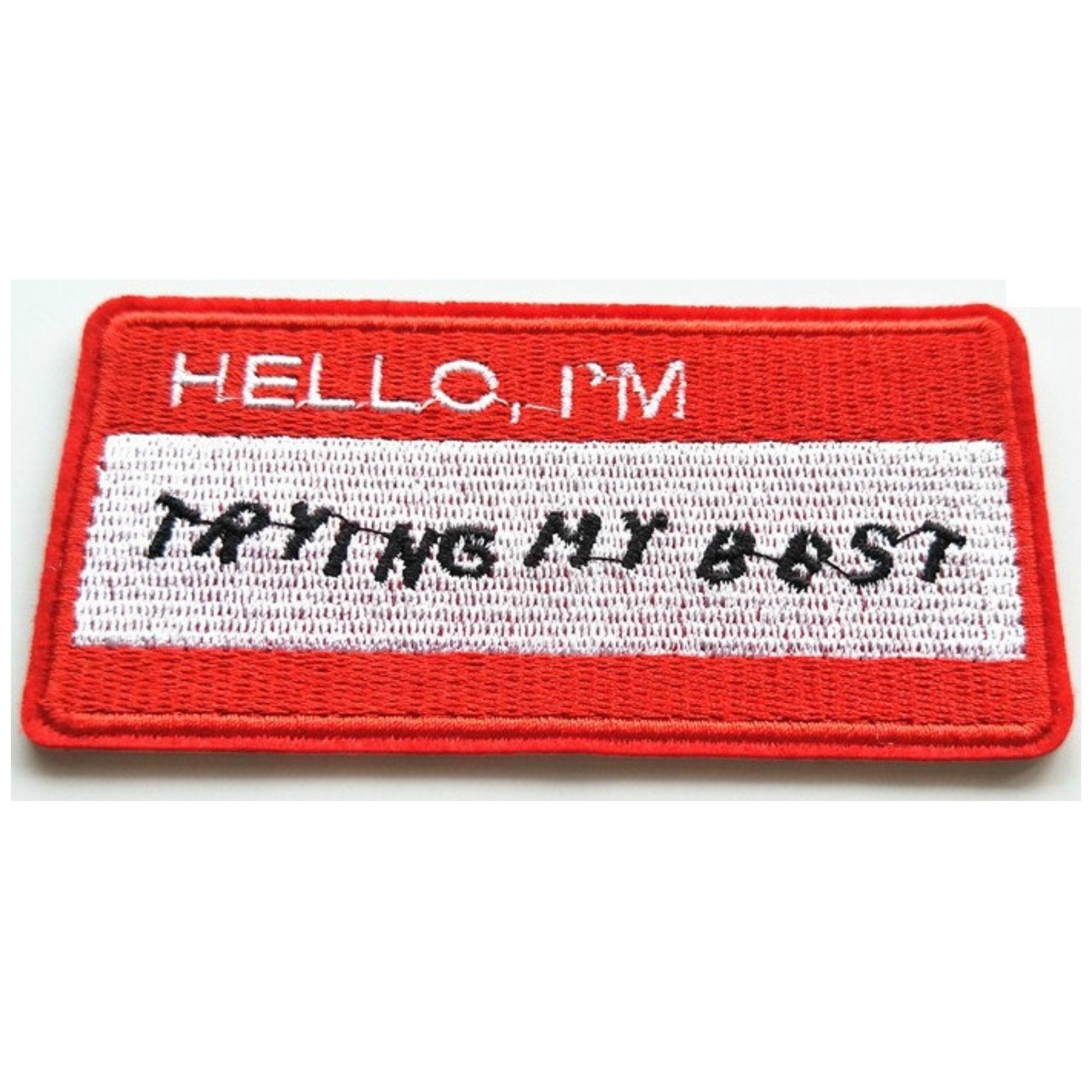 https://www.minimummouse.com/cdn/shop/products/hello-im-trying-my-best-name-badge-iron-on-patch-318747_2400x.jpg?v=1594219234